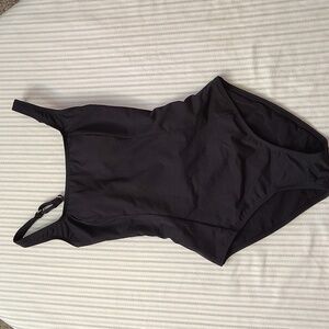 Adorable black one piece with lace up back in small.
